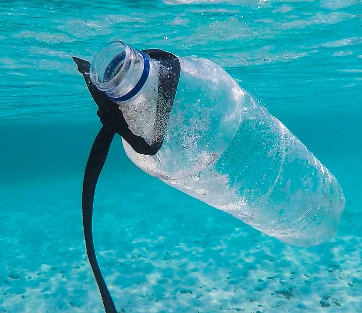 A plastic bottle floating in the water.